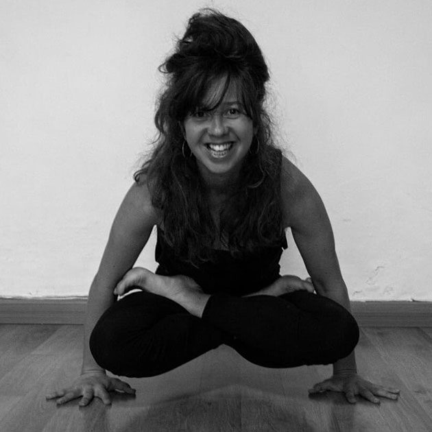 Danni smiling in yoga pose