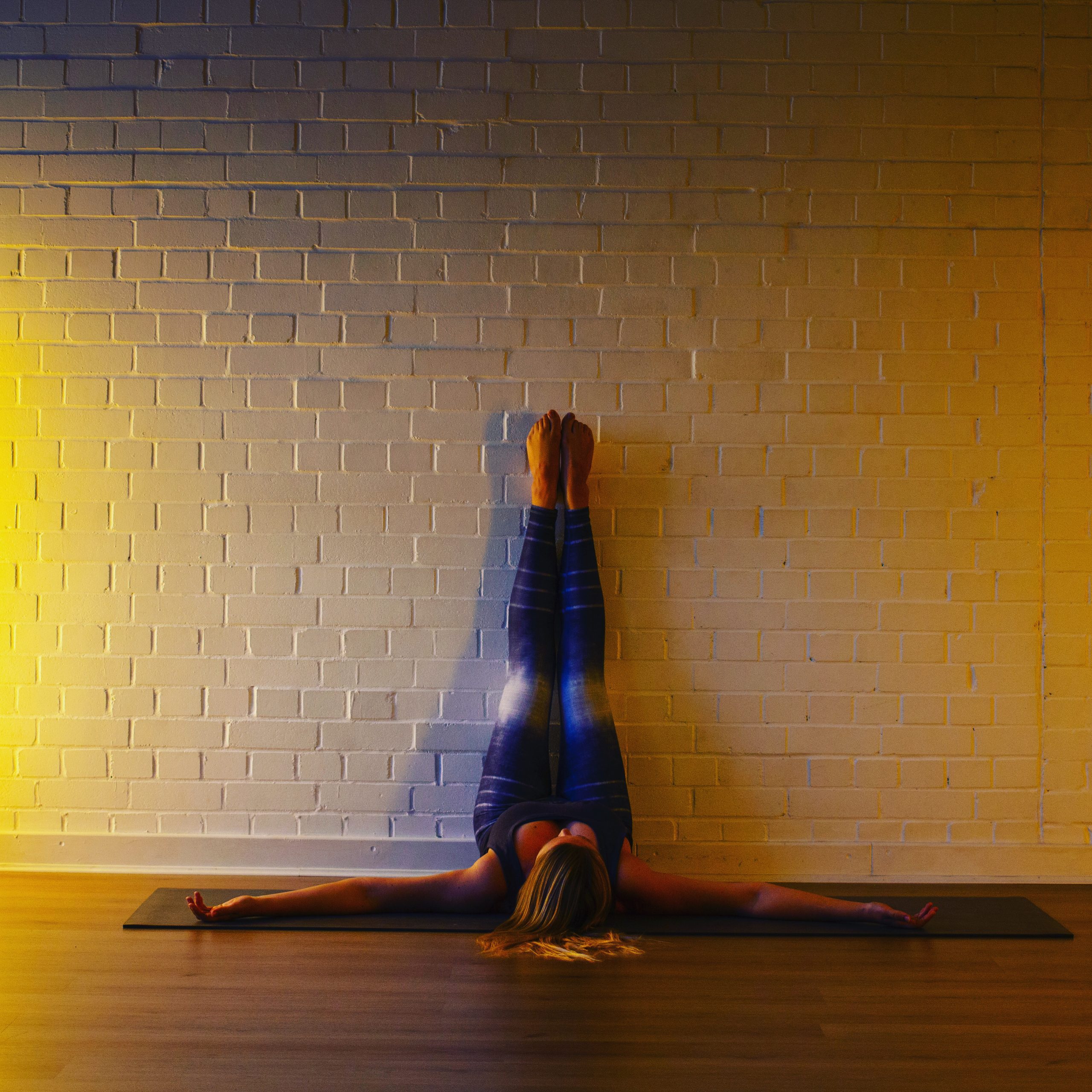 Nadine in viparita karani yoga pose