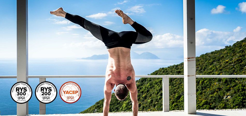 Martin Sittek in handstand in Lefkada Island with a small island in the background