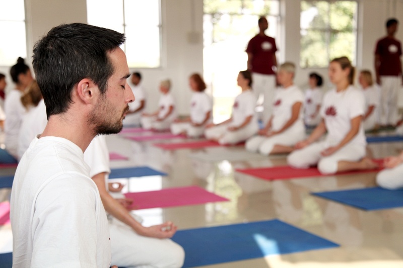 yoga teacher and students in yoga teacher training in India