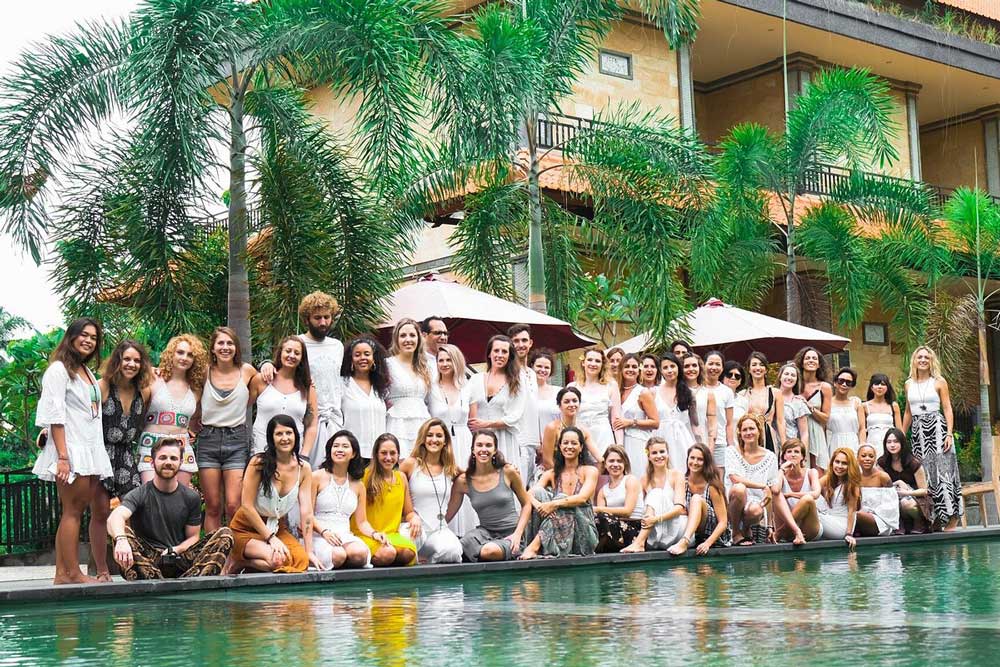 Group picture of yoga students in Bali during a yoga teacher training with House of Om.